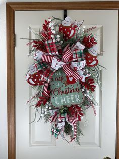 a christmas wreath hanging on the front door