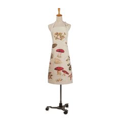 an apron on a mannequin with mushrooms and mushrooms all over the dress,