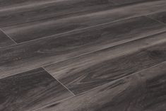 an image of wood flooring that looks like it has been painted in dark grey