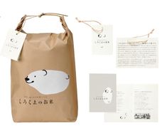 a paper bag with an image of a polar bear on the front and two tags attached to it