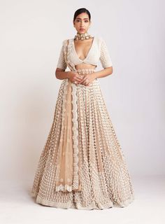 Editor's Note Elevate your style to new heights with this resplendent beige chandelier pearl lehenga, exquisitely paired with a V-neck blouse adorned with elaborate pearl embellishments and ele... Pearl Work Lehenga, Beige Chandelier, Pearl Lehenga, Vani Vats, Blouse Yoke, Pearl Work, Full Sleeve Blouse, Georgette Dupatta, Beige Blouse