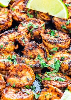 grilled shrimp with lime wedges and cilantro on the side, ready to be served