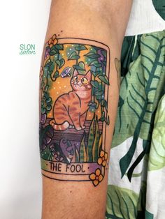 an orange cat sitting on top of a bench with the words the fool written below it