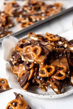 chocolate pretzels with caramel drizzled on top in a white bowl