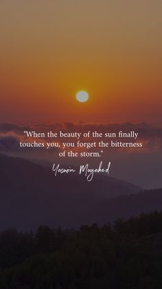 the sun setting over mountains with a quote on it saying, when the beauty of the sun finally touches you, you forget the bitterness