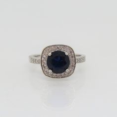 Vintage Sterling Silver Blue Sapphire & White Topaz Halo Ring...Marked 925...Total of weights 3.8grams... Size 5...Measure of Face 12MM...It's in very good condition. Classic Sapphire Halo Ring With Accent Stones, Blue Sterling Silver Birthstone Ring With Center Stone, Sterling Silver Blue Topaz Ring With Center Stone, Classic Blue Jewelry With Halo Setting, Blue Sapphire Ring With Vs Clarity And Round Cut, Classic Blue Cubic Zirconia Jewelry, Blue Sapphire Ring With Diamond Accents In Sterling Silver, Classic Blue Jewelry With Center Stone, Sapphire Diamond Ring With Sterling Silver And Diamond Accents