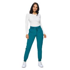 PRICES MAY VARY. RIBBED KNIT WITH DRAWSTRING CLOSURE- This jogger combines the comfort of a soft knit waistband and stability of an added drawstring. 6 ROOMY POCKETS- Our scrub joggers come with all the pockets you need including 2 back, 2 cargo, and 2 hip pockets. BREATHABLE STRETCHY MATERIAL- These scrub pants are made from a material engineered to be durable, breathable and flexible. PETITE AND REGULAR SCRUB JOGGERS- When it comes to scrub joggers the length is key- you deserve scrubs that fi Sports Bottoms With Stretch And Ribbed Cuffs, Stretch Bottoms With Ribbed Cuffs For Sports, Stretch Joggers With Comfort Waistband For Fall, Fall Stretch Joggers With Comfort Waistband, Fitted Full-length Joggers With Elastic Waistband, Fall Fitted Joggers With Ribbed Waistband, Fitted Fall Joggers With Elastic Waistband, Green Stretch Pants With Ribbed Waistband, Stretch Full Length Joggers For Fall