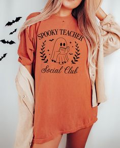 Spooky Teacher Social Club t-shirt.  These tees are Comfort Colors and are made to last using premium ringspun cotton, this creates an vintage-soft shirt. The soft-washed, garment-dyed fabric brings extra coziness to your wardrobe while the relaxed fit makes it an excellent daily choice. ✦ 100% Ringspun Cotton ✦ Relaxed fit ✦ Medium fabric ✦ Sewn-in twill label ✦ Eco-friendly, Ethically Made & Sweatshop Free ✦ Printed to order with non-toxic ink ✦ Durable and Long-lasting ✦ Shirts are pre-shrunk Teacher Halloween, Photo Care, Teacher Team, The Only Exception, Teachers Halloween, Club T Shirt, Ghost Shirt, Teacher Tees, Vintage Soft