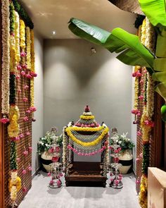 a decorated stage with flowers and garlands