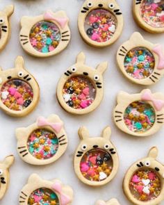 some cookies decorated like animals with sprinkles on them