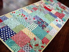 a close up of a quilt on a table