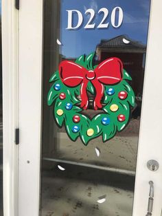 a door with a christmas wreath on it