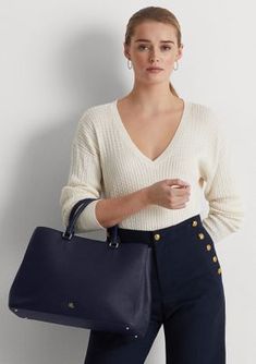 Whether you wear it to work or while running errands, the large Hanna satchel features a sleek, spacious silhouette with a myriad of pockets for storing your necessities. Punctuated with a polished LRL logo, this style is rendered in crosshatch leather for subtle texture and a sophisticated sensibility. Two top handles, each with a 4.5" drop Removable, adjustable crossbody strap with a 16.75" maximum drop length Polished "LRL" metal logo at the front Exterior slip pocket Zip pocket and a slip po Blue Top Handle Satchel For Work, Fall Double Handle Satchel For Workwear, Modern Navy Office Bag, Blue Leather Satchel For Work, Blue Leather Shoulder Bag For Work, Leather Blue Satchel For Workwear, Modern Blue Satchel For Work, Workwear Structured Satchel With Detachable Handle, Casual Satchel With Leather Handles For Work