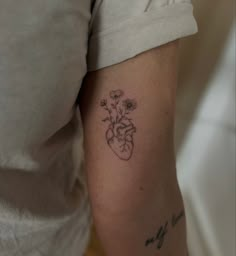 a woman's arm with a small tattoo on it that says, my love