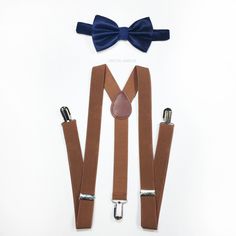 ★color: navy blue bow tie and brown suspenders matching set for children 5+, teens and adults ★suspenders size measurement fits children 5 years old+, teens and adults full length 42 inches width 1 inch ★bow tie measurement adjustable neck strap is 10 to 18 inches or 25 cm to 45 cm bow tie is 3 1/2 inches or 9 cm across ♥ More items for adults and toddlers here: https://www.etsy.com/shop/crystalAmour All orders placed will be processed and shipped in 24-48 business via USPS. We ship all items ou Adjustable Brown Bow Tie For Party, Dapper Adjustable Belts And Suspenders With Ties, Adjustable Brown Bow Tie In Dapper Style, Dapper Brown Bow Tie With Tie Back, Adjustable Brown Belts And Suspenders With Bow, Dapper Adjustable Bow Tie For Father's Day, Adjustable Dapper Bow Tie For Father's Day, Navy Blue Bow Tie, Blue Bowtie