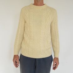 "Hand Knit Irish Fisherman Sweater Cable knit unisex sweater Men's fitted Medium Model is 6'3\" tall and 165 lbs. Men's Sweater but would look good on a woman worn long. For women: This is pretty long and will go over your bottom (shorter women) most likely unless you are super tall. I wear a size small- and it just hugs the body gently (not tightly). It will hang loosely on a thinner person and not hug body. Would look great with skinny jeans or leggings worn over sized without being sloppy. Al Cozy Fitted Sweater For Cold Weather, Classic Fitted Sweater For Cold Weather, Fitted Wool Sweater With Textured Knit, Classic Hand Knitted Sweater For Winter, Fitted Cream Sweater For Winter, Fitted Cream Winter Sweater, Fitted Wool Knitted Sweater, Fitted Wool Sweater, Crew Neck Knit Sweater For Cold Weather