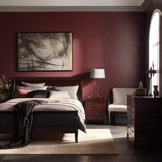 a bedroom with red walls and furniture in the corner, along with a painting on the wall