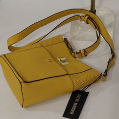 Madden Described This Bag As A Mustard Colored, Vegan Leather, Bucket Style Crossbody Bag. Features Inside And Outside Pockets, Adjustable Strap And Gold Hardware. Nwt. Bag Measures 9" X 9" With A 5" Base. Straps Have A 25+" Drop. Chic Yellow Satchel With Mobile Phone Bag, Chic Yellow Satchel With Phone Bag, Yellow Tote Satchel With Mobile Phone Bag, Yellow Crossbody Satchel With Gold-tone Hardware, Trendy Yellow Shoulder Bag With Cell Phone Pocket, Yellow Shoulder Bag With Removable Pouch, Yellow Satchel Shoulder Bag With Cell Phone Pocket, Yellow Crossbody Bag With Cell Phone Pocket, Yellow Satchel With Adjustable Strap