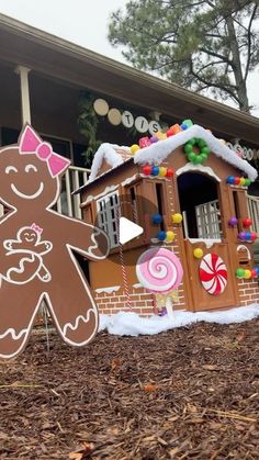 a gingerbread house is decorated with candy and candies for the holiday season in front of a home