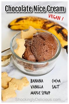 chocolate ice cream in a glass bowl next to a banana and star shaped cookie pieces