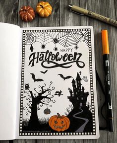 an open halloween coloring book with pumpkins, bats and other items on the table