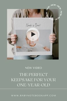 a woman holding up a sign that says new video the perfect keepsake for your one - year - old