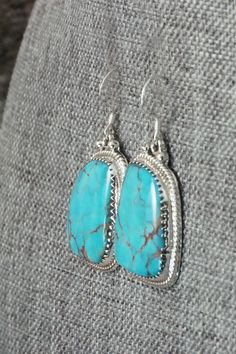 These Kingman turquoise and sterling silver earrings were made by Navajo silversmith Sharon McCarthy. The back is signed RB and stamped .925.Length: 1 1/2"Width: 3/4"Free shipping on all orders! We ship with USPS and always include tracking. All orders ship within a day of payment.Returns are accepted up to 30 days after you receive your order. Just send us a message. Our shop offers cash back or store credit. The item must be returned in new condition. Kingman Turquoise, Native American Jewelry, Turquoise Jewelry, Free Jewelry, Sterling Silver Earrings, Turquoise Necklace, Silver Earrings, Coral, Stamp