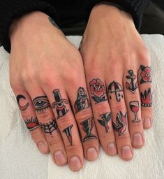 two hands with different tattoos on them