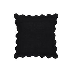 a black pillow with scalloped edges