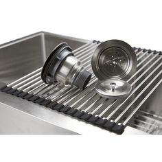 a stainless steel sink with a strainer on top