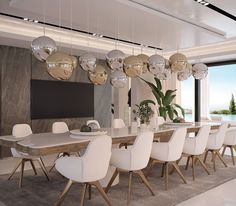 a large dining room table with white chairs