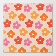 an orange and pink flower pattern on a white background