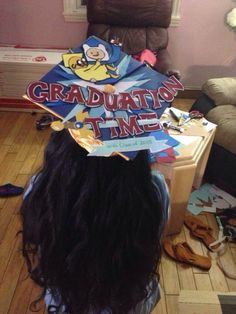 a girl with long black hair wearing a graduation cap that says graduation time on it