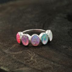 Opal Eternity Band, Fire Opal Band, Bezel Set Opal Ring, Dainty Opal Ring, Gold Opal Ring, October Birthstone, Handmade Ring, Opal Ring   Main Stone: Opal ( Lab-Created) Main Stone Color: Pink Main Stone Shape: Oval S I L V E R J E W E L R Y C A R E Silver is not the best friend of oxygen and sulfur; it can be oxidized and tarnished from time to time it is the nature of silver. To keep the silver shiny and prevent it from oxidizing fast, we would recommend the following instructions: * Avoid any Anniversary Stackable Rings With Stones, Opal Ring With Bezel Setting Gift, Silver Opal Multi-stone Ring, Opal Multi-stone Ring As A Gift, Dainty Opal Ring, Nickel-free Adjustable Opal Rings, Sparkly Rings, Spiritual Silver Opal Ring With Multi-stone, Sterling Silver Multi-stone Opal Ring As Gift