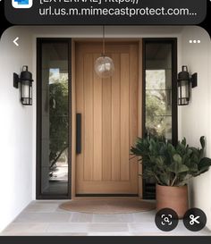 an image of a front door with plants