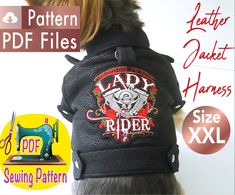 the back of a dog wearing a black jacket with an embroidered lady rider logo on it