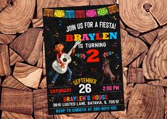 this is a birthday party for a boy with guitar and dog on the wood background