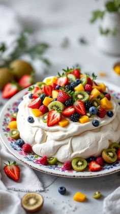 a cake with fruit on it sitting on top of a plate