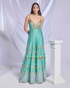 A teal green raw silk flared jumpsuit, featuring our iconic 3D embroidery adorned with glass cut beads, crystals, gold chains, and shells.From Papa Don’t Preach’s Bring Your Own Fairytale collection. DELIVERY TIMEPlease allow 8-12 weeks for your outfit to arrive. FABRIC DETAILSRaw Silk Professional cleaning only. Engagement Sarees, Teal Jumpsuit, Reception Sarees, Papa Don't Preach, Haldi Dress, Flared Jumpsuit, Trendy Outfits Indian, Bridal Jumpsuit, Wedding Jumpsuit