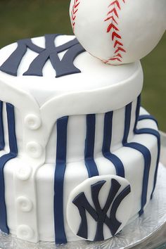 a cake decorated to look like a baseball and bat