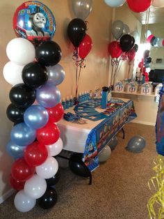 a birthday party with balloons and decorations