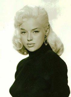 a black and white photo of a woman with blonde hair