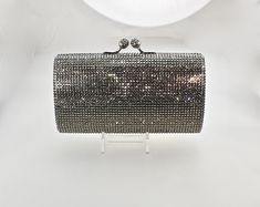 "Heart- stoppingly beautiful! This Evening Formal Purse in Stunning Colors will be the talk of town!! It took a month to make, crystal by crystal! This is a evening bag fully covered in genuine, very fine, small sized Swarovski Crystals from Austria! The minaudiere bag is fully crystallized in all sides with meticulous and spectacular detail. It is also lined in genuine leather. You can carry it as a clutch but it comes with a very long detachable metal chain to be used as a shoulder strap so yo Luxury Sparkling Clutch For Weddings, Luxury Wedding Clutch With Bling, Luxury Sparkling Evening Bag For Wedding, Luxury Sparkling Bags For Weddings, Luxury Sparkling Crystal Evening Bag, Silver Rectangular Evening Bag For Reception, Minaudiere Bag, Formal Purse, Bridal Purse