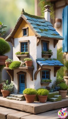 a doll house with potted plants in front of it