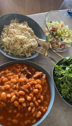 three bowls filled with different types of food