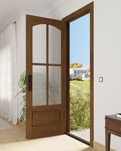 an open wooden door in a white room