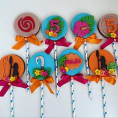 there are many decorated lollipops on the stick with name and number in them