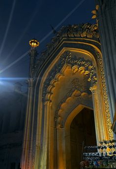 the light shines brightly on an ornate building