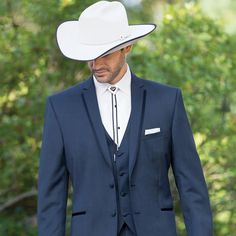 Classic Western Cowboy Tuxedo In Navy. All You Need Is To Put On A Hat, And Throw On Your Bolo Tie And You'll Be Good To Go! Pants Come 6 Inches Smaller Than Jacket, And Can Adjust 2 Inches Out Or 4 Inches In. This Trim Tuxedo Comes In A 2 Button Jacket, With Matching Flat Front Pants And A Matching Vest. Cowboy Tuxedo, Wedding Suit Blue, Cowboy Suit, Blue Suit Wedding, Mens Cowboy, Flat Front Pants, Navy Suit, Bolo Tie, Button Jacket