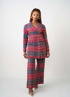 Style#: 2098/ P2098 Meaning elegant, Aniq, this stretch blazer dress with its detachable belt, 2 flap pockets, and polyester satin lining is the showstopping piece of the fall collection. The African-inspired Harvest Plaid Adire print is perfect for the fall season; you'll stand out and fit the aesthetic of autumn. Wear it on its own or pair it with our Talia stretch pants! Features Notch Collar Single Button Closure at Center Waist Slight Flare in the Sleeve Polyester Satin Lining 72% Rayon/ 24 Fitted Belted Blazer Dress With Notch Lapel, Fitted Notch Lapel Belted Blazer Dress, Fitted Notch Lapel Blazer Dress With Belt, Fitted Long Sleeve Blazer With Belt, Fall Semi-formal Belted Blazer Dress, Belted Fitted Blazer Dress For Semi-formal Occasions, Tailored Belted Blazer Dress For Semi-formal Occasions, Semi-formal Fitted Belted Blazer Dress, Semi-formal Fitted Belted Blazer